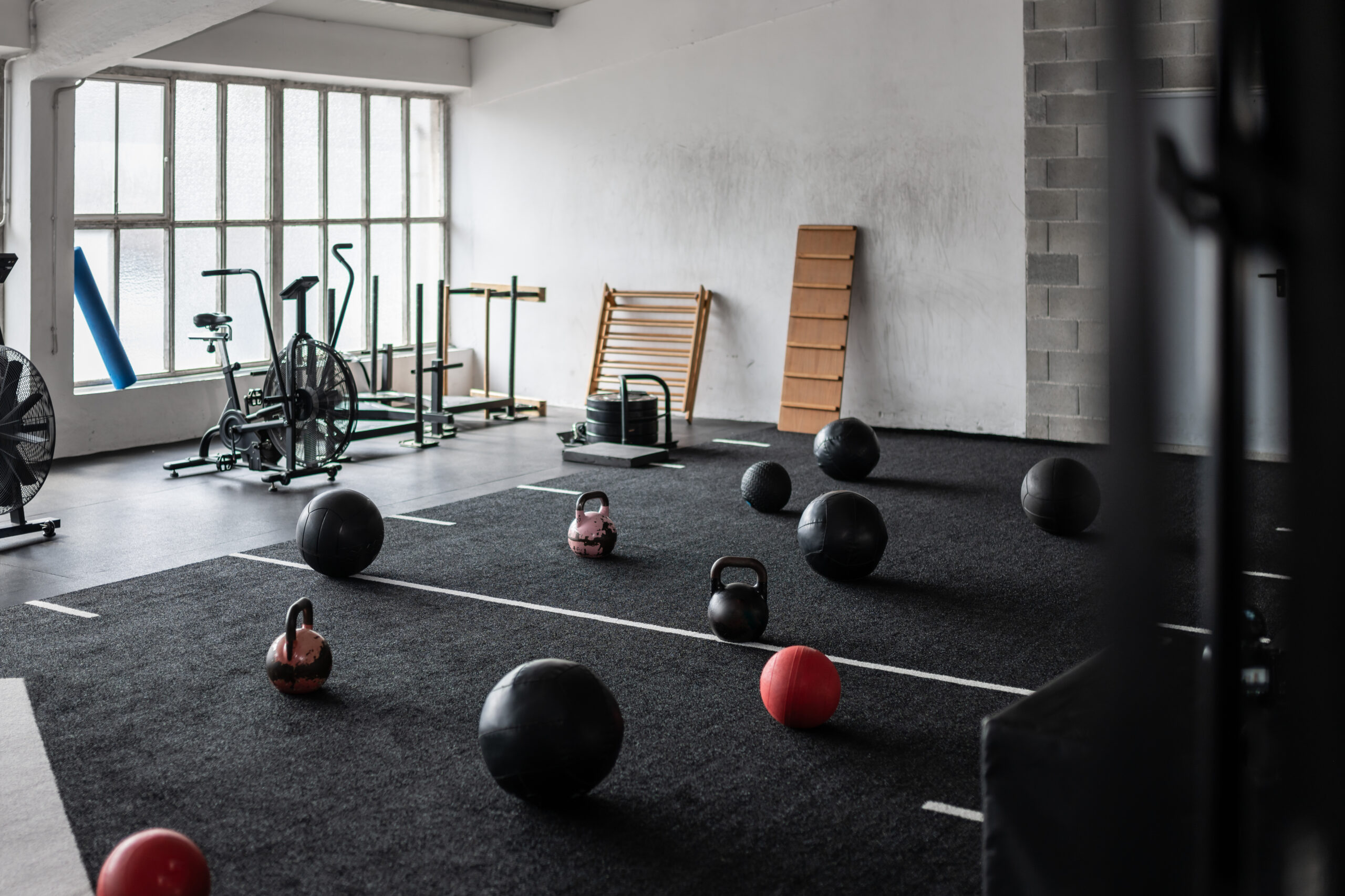 Kettlebells and medicine balls in gym