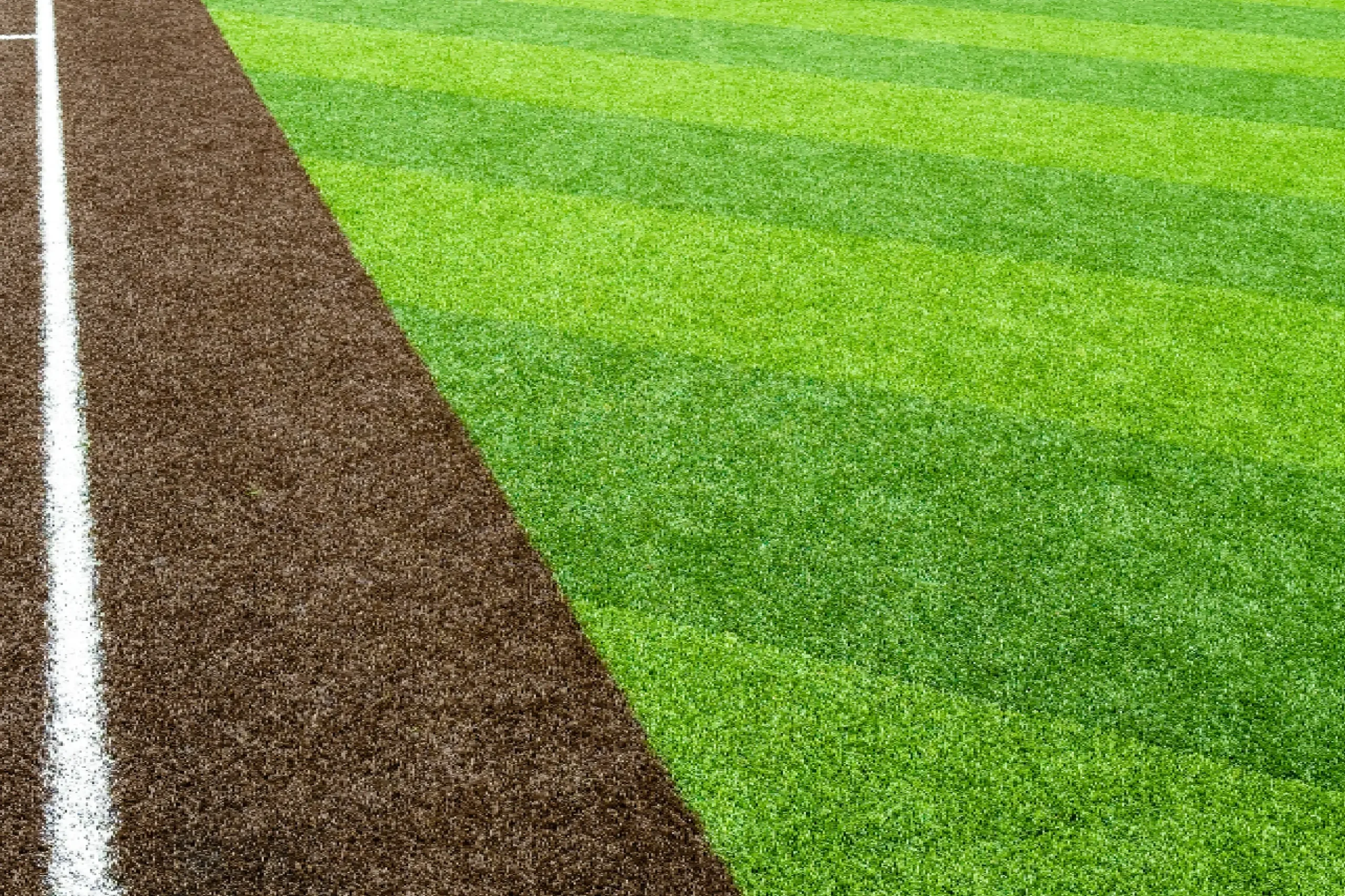 Baseball field with green grass and dirt