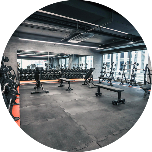 Spacious gym with weights and benches